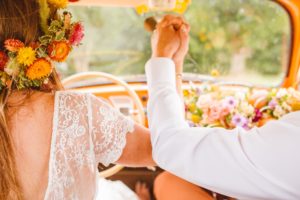 Bride and groom holding hands in vintage VW bug | Brooke Michelle Photography
