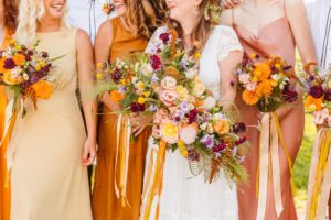 Bride with wedding party holding hand-tied bouquet | Brooke Michelle Photography