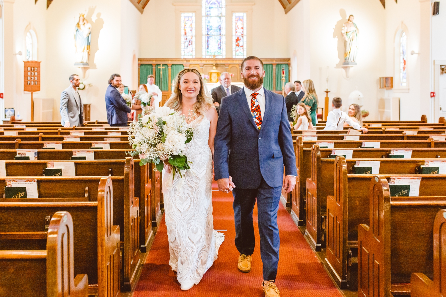 Bride and groom exiting ceremony | Brooke Michelle Photography