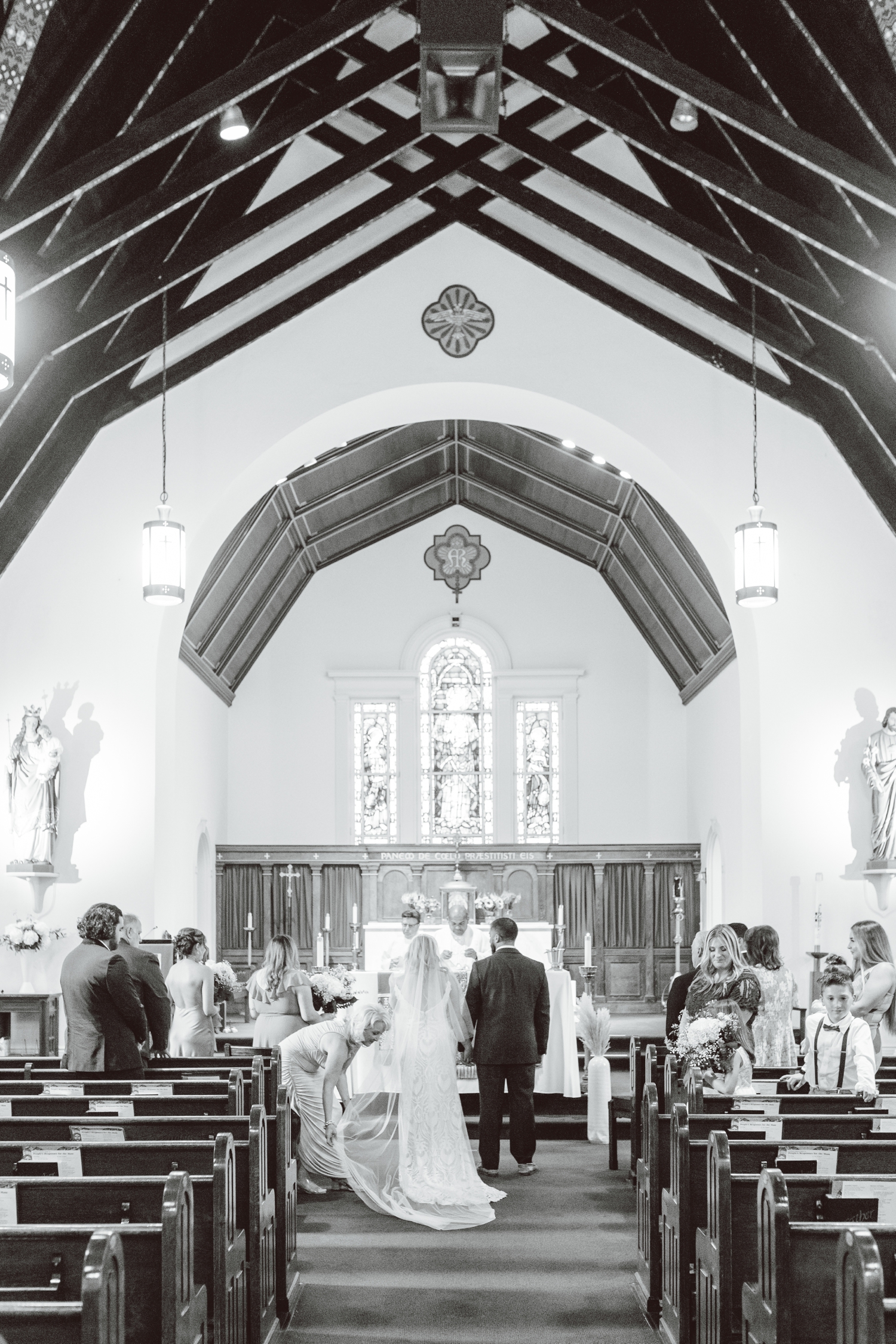 Bride and groom standing at altar in Sag Harbor church | Brooke Michelle Photography