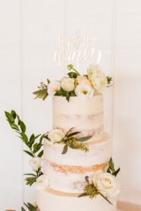 Three tier wedding cake with semi-naked icing | Brooke Michelle Photography