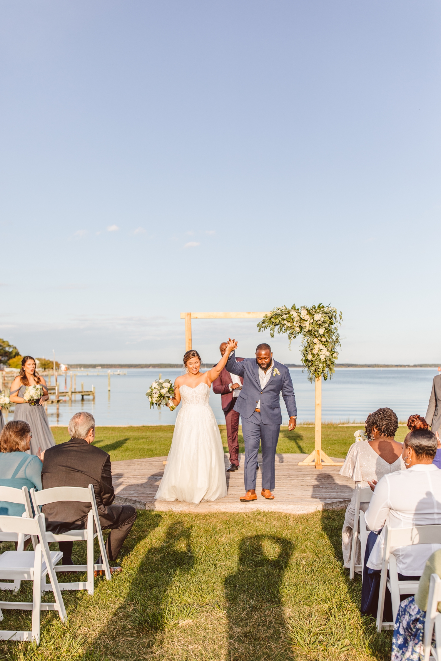 Bride and groom exiting ceremony at Wylder Hotel Tilghman Island wedding | Brooke Michelle Photography