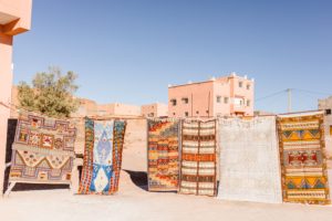 Photo taken by travel photographer of colorful rugs hanging on line outside in Marrakesh, Morocco | Brooke Michelle Photography