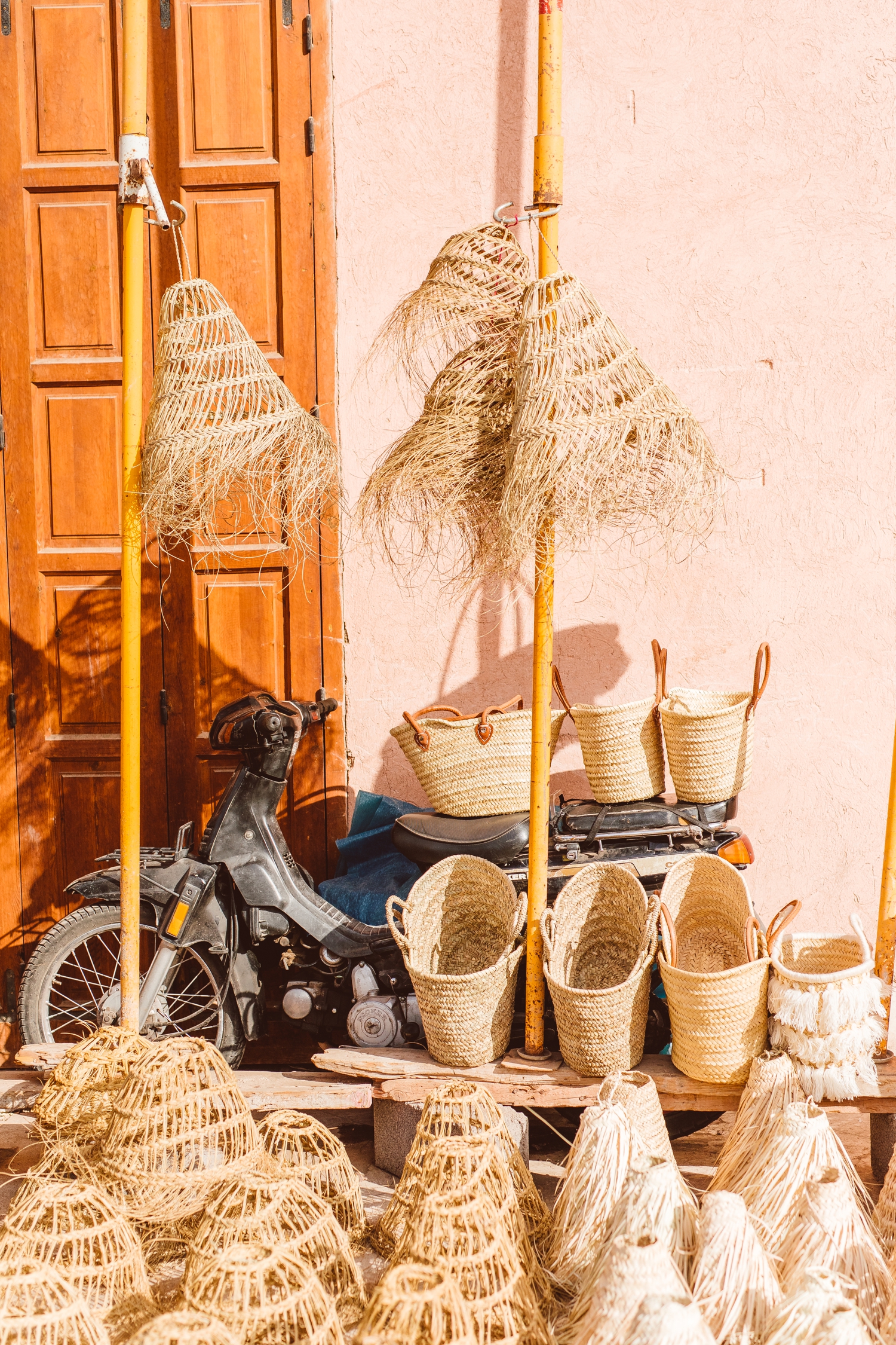 Straw baskets for sale at outdoor market in Marrakesh, Morocco | Brooke Michelle Photography