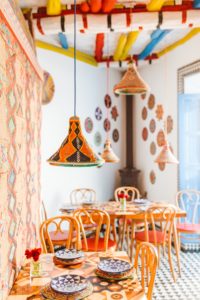 Restaurant with bright orange chairs and colorful decor in Marrakesh, Morocco | Brooke Michelle Photography