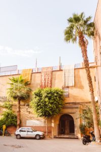Moroccan building with woven fabric hanging down from roof | Brooke Michelle Photography