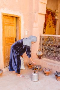 Photo taken by travel photographer of Moroccan woman preparing food | Brooke Michelle Photography
