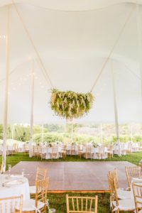 Floral chandelier in tent at Ladew Topiary Garden wedding | Brooke Michelle Photo