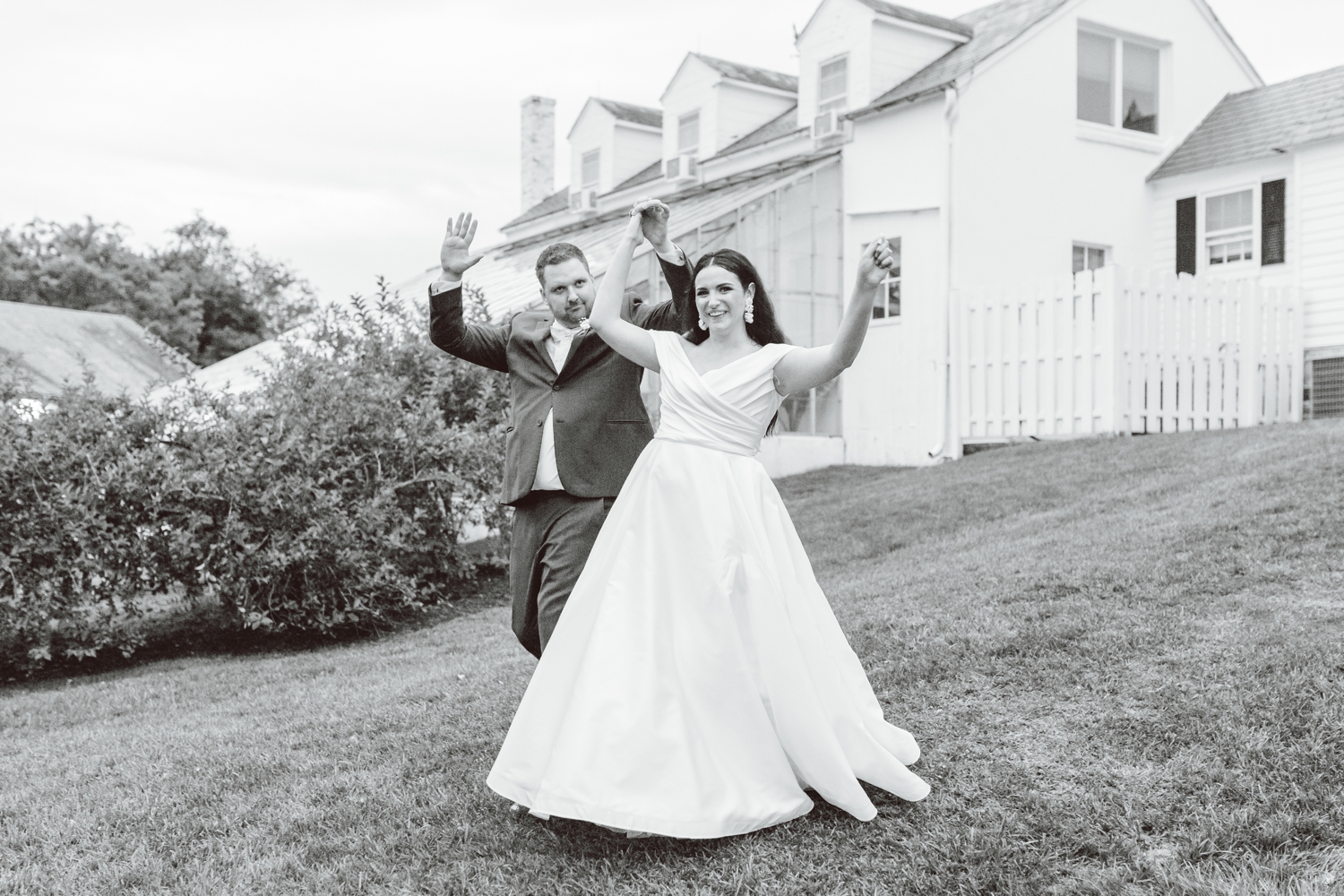 Couple holding hands and entering wedding reception | Brooke Michelle Photo