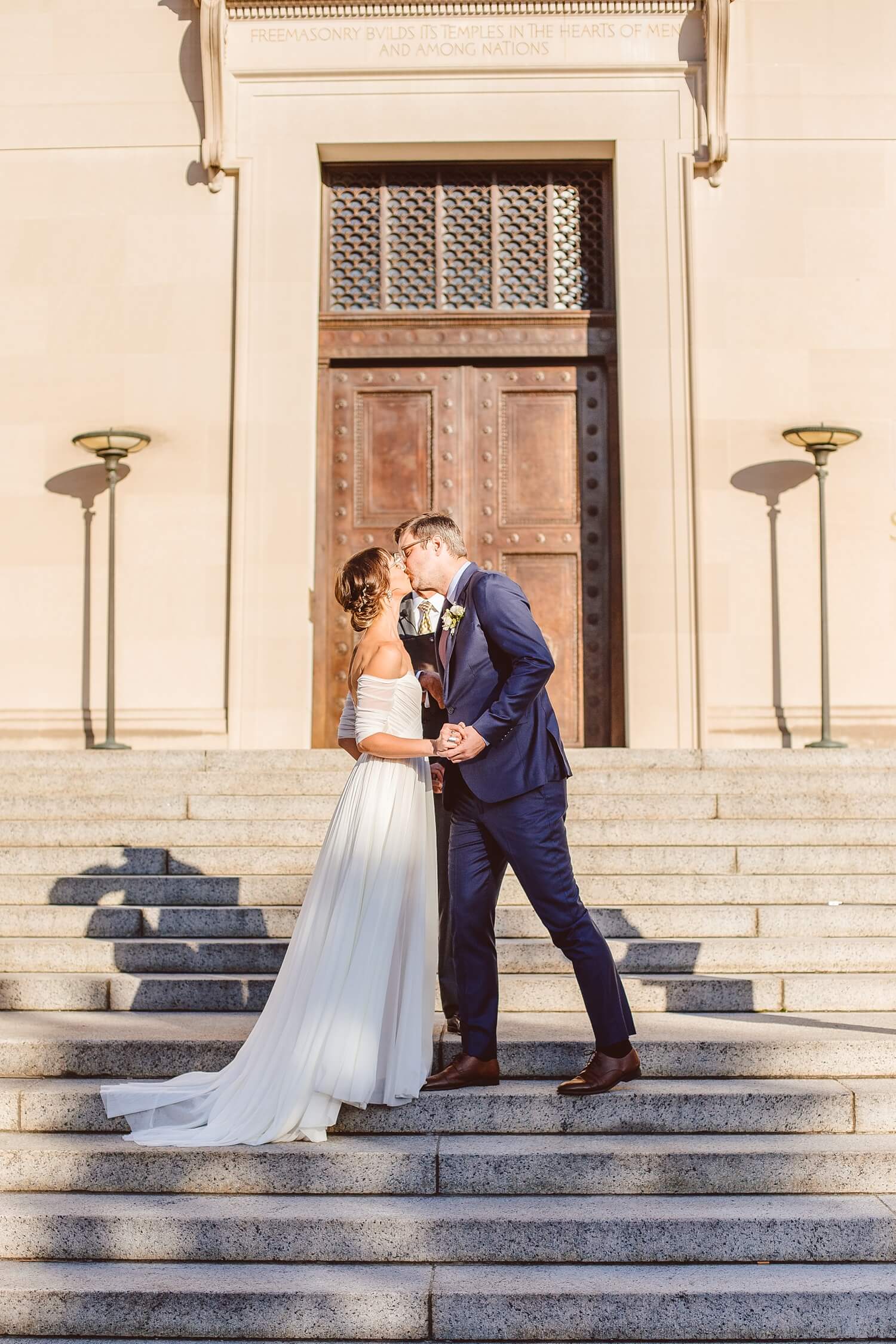 Bride and groom kissing at end of wedding ceremony in Washington DC | Brooke Michelle Photography