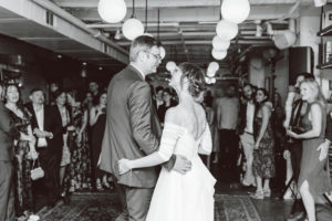 Bride and groom looking each other during dance at wedding reception | Brooke Michelle Photography
