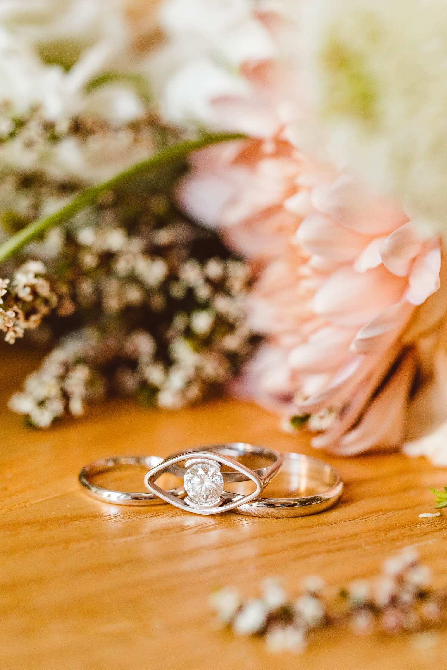 Unique engagement ring with flowers in the background | Brooke Michelle Photography