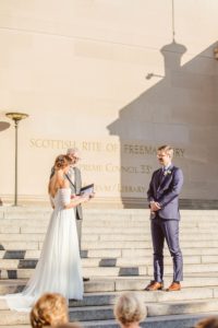 Bride reading vows to groom during Washington DC wedding ceremony | Brooke Michelle Photography