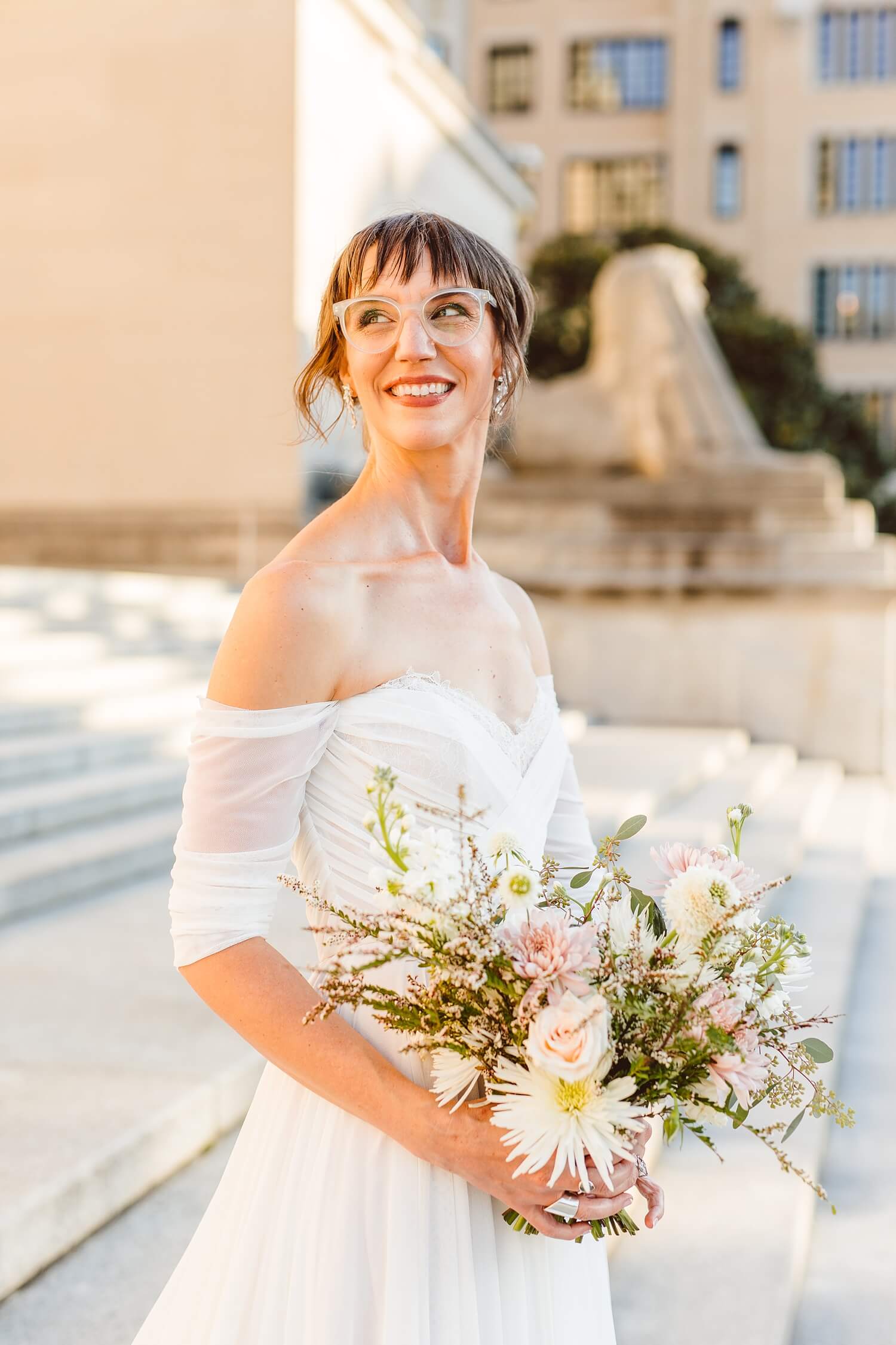 Bride holding bouquet and looking off into the distance | Brooke Michelle Photography