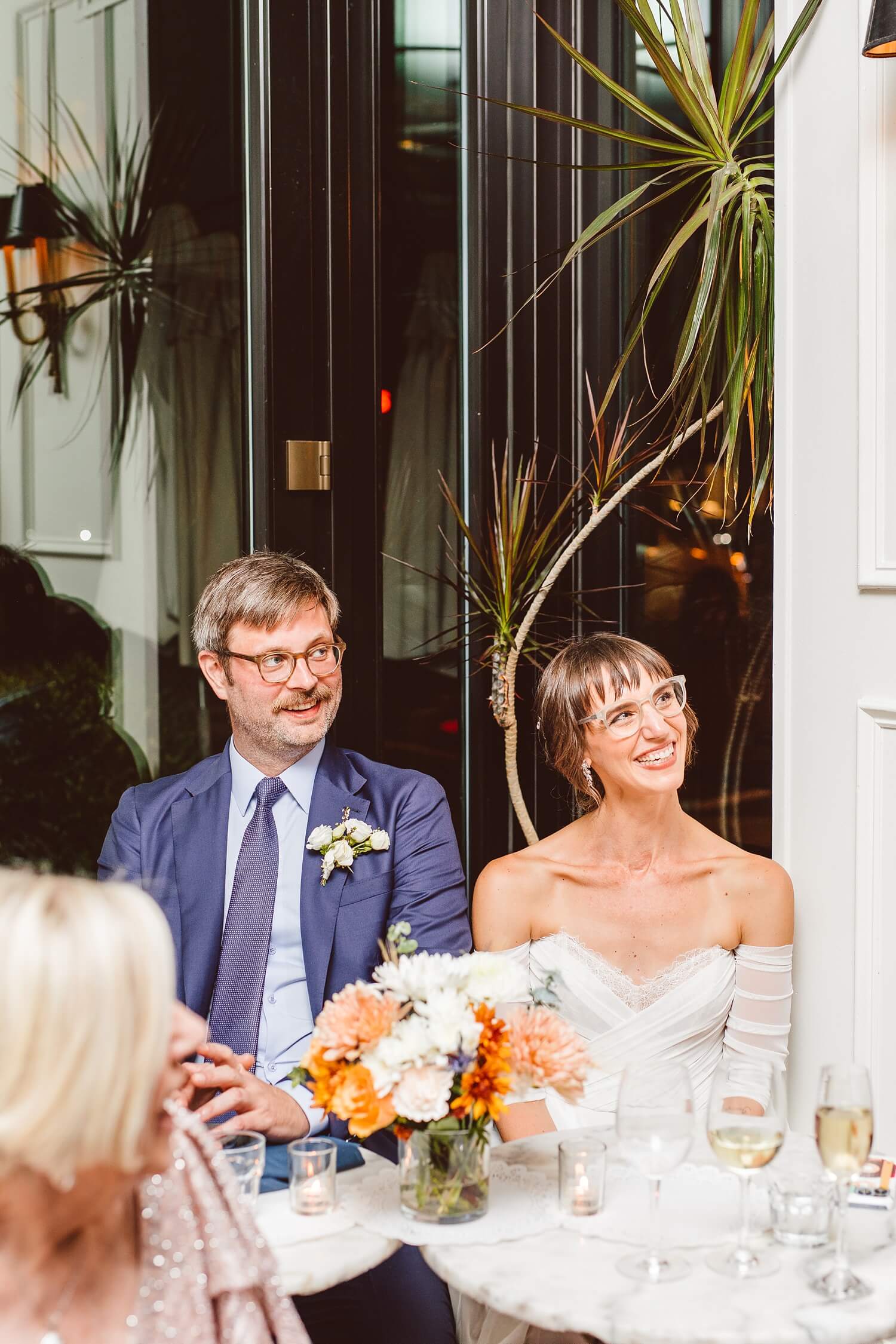 Couple smiling during wedding reception toasts | Brooke Michelle Photography