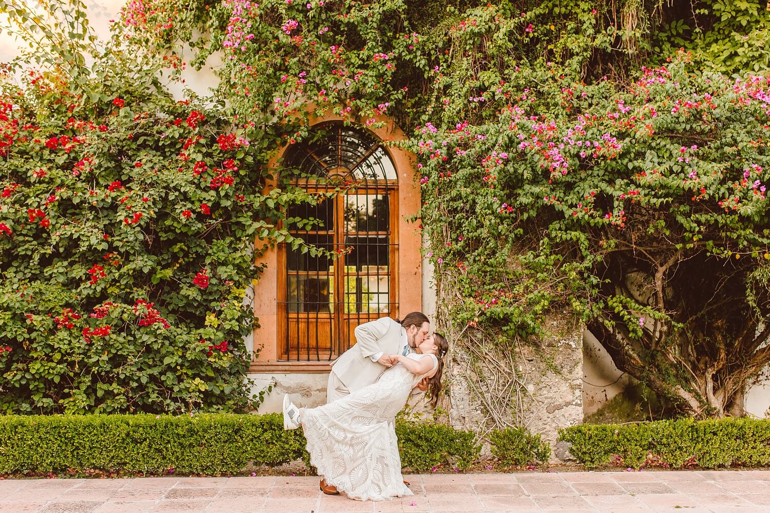 Groom dipping bride and kissing her at Mexico destination wedding | Brooke Michelle Photo