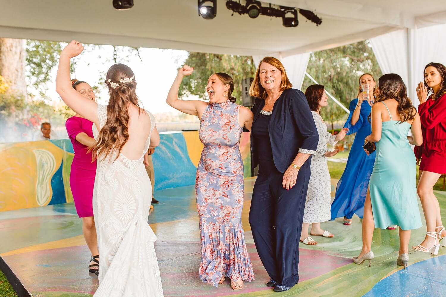 Bride dancing with wedding guests at destination wedding | Brooke Michelle Photo