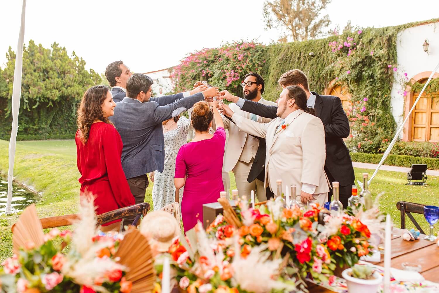 Wedding guests toasting during wedding reception in Mexico | Brooke Michelle Photo