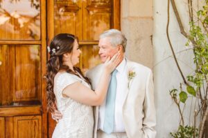 Bride touching father's face during first look | Brooke Michelle Photo