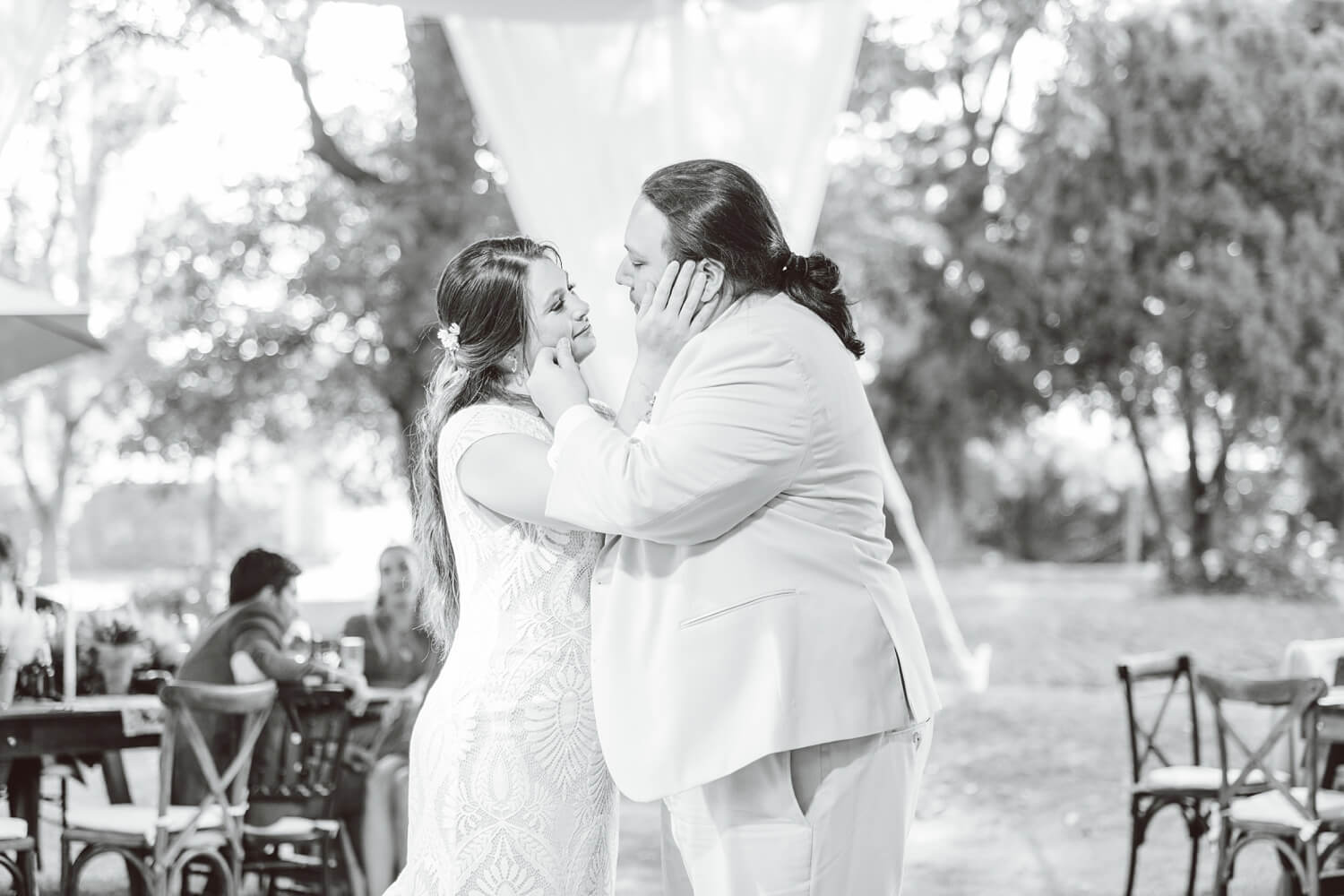 Couple touching each other's faces during first dance | Brooke Michelle Photo