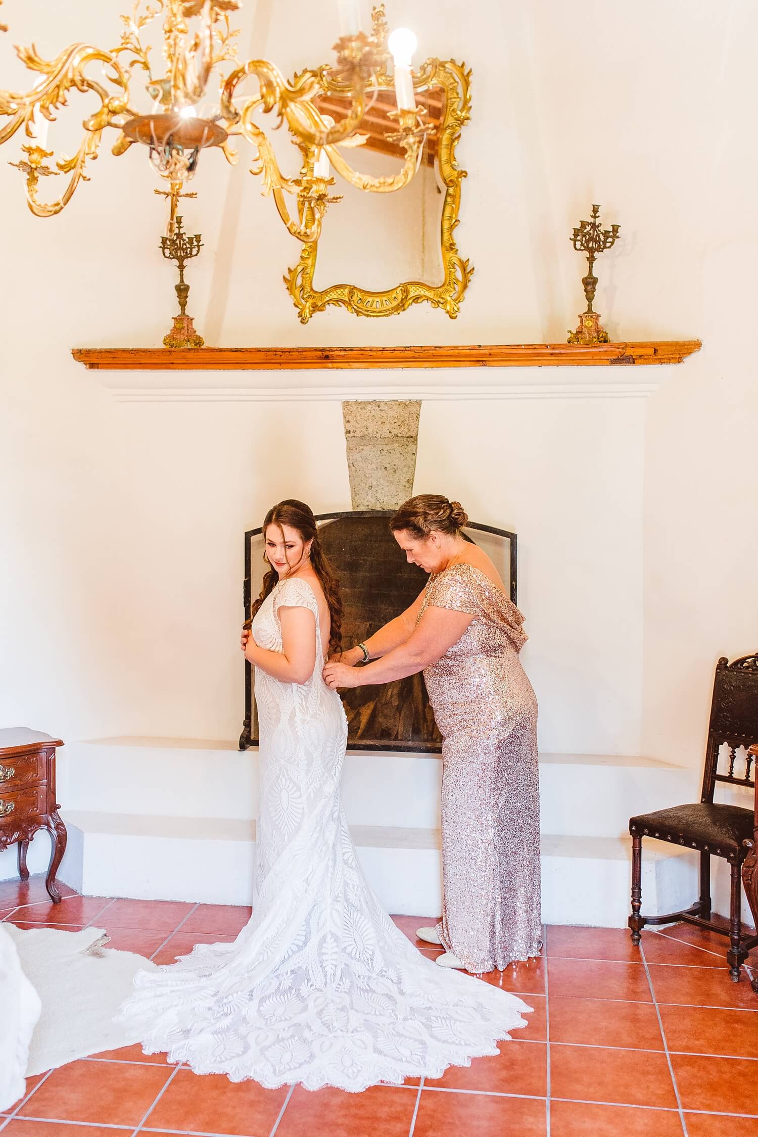 Mom helping bride into wedding dress | Brooke Michelle Photo