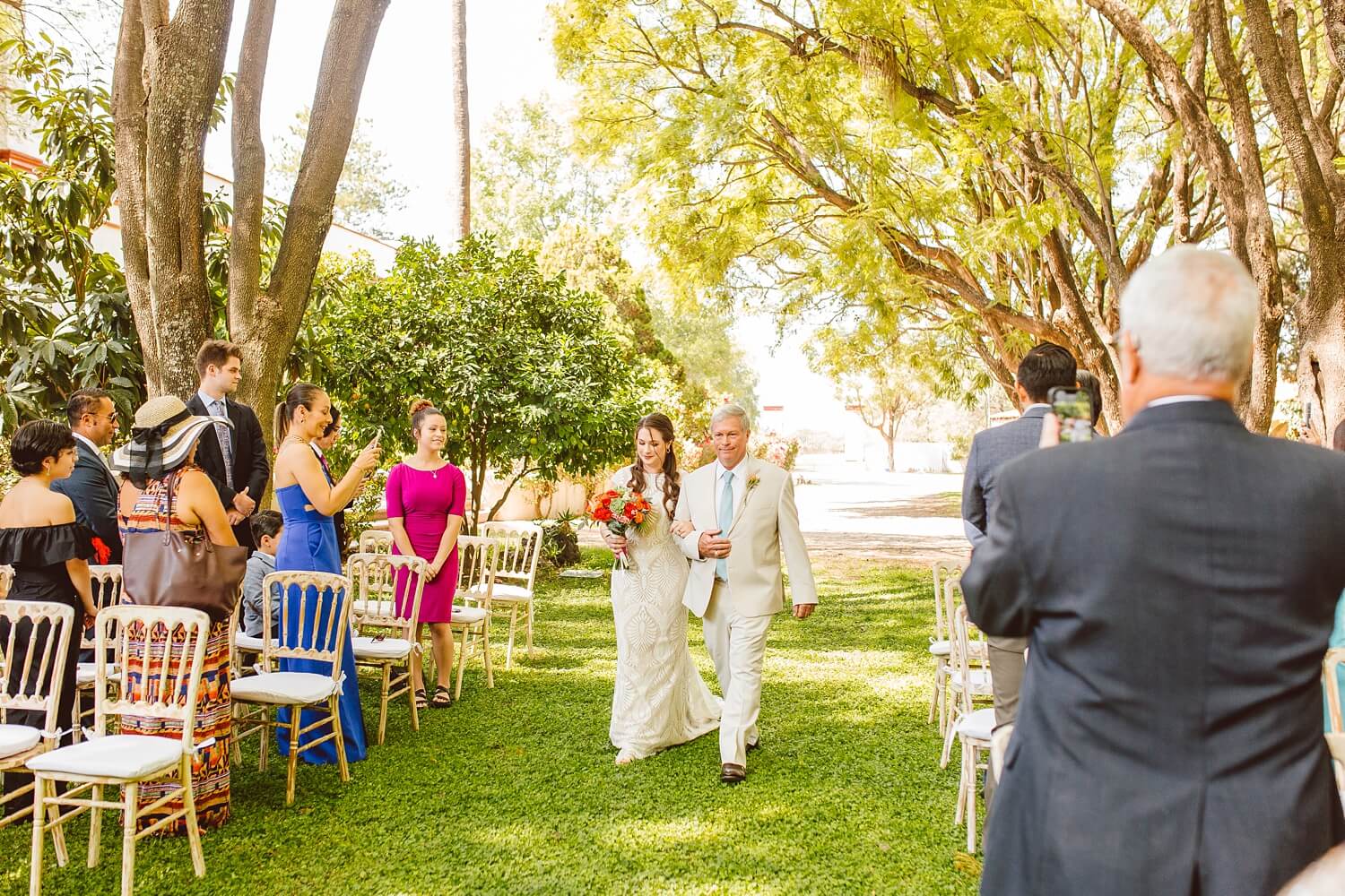 Bride walking down the aisle with father at Mexico destination wedding | Brooke Michelle Photo