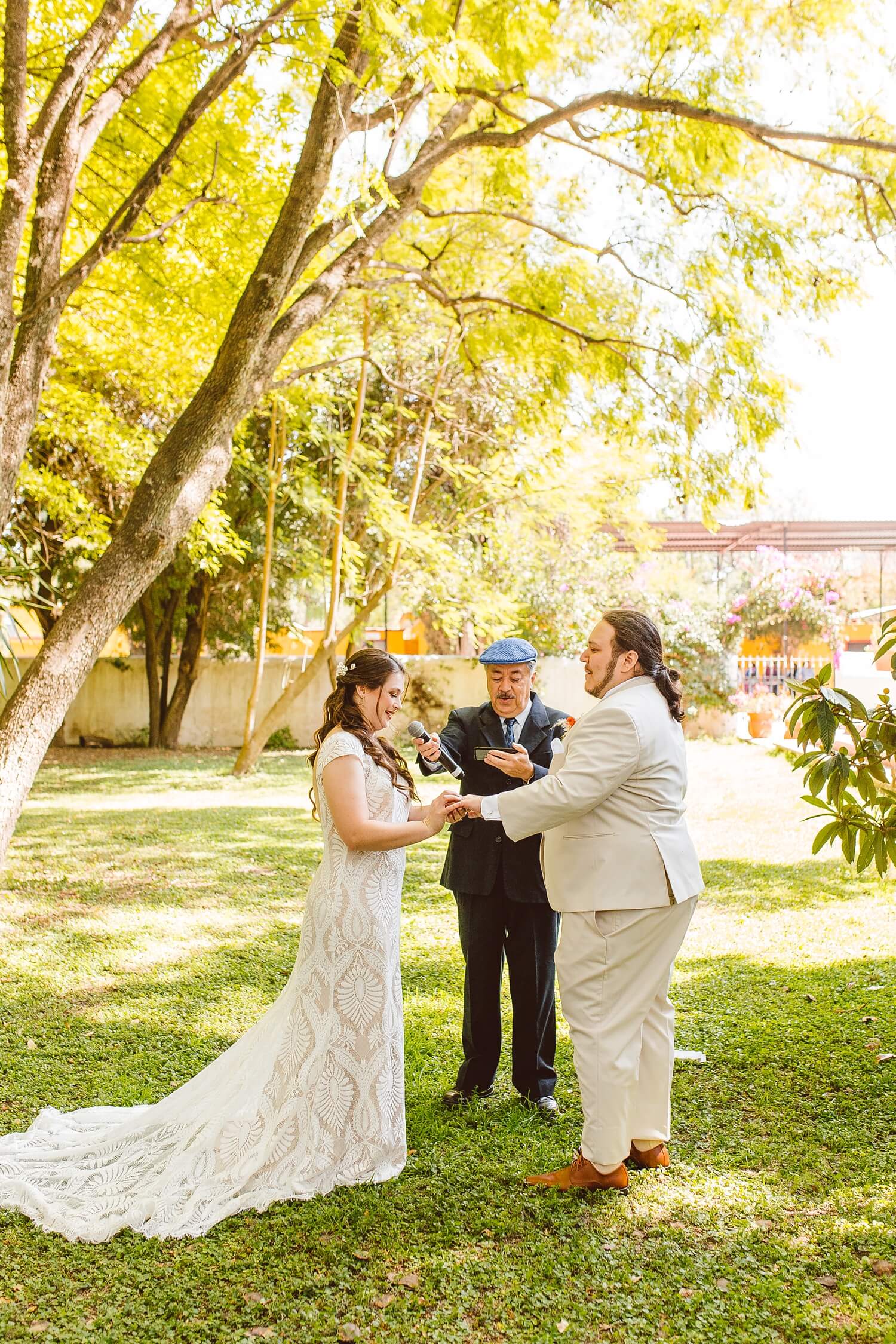 Bride and groom holding hands during ceremony in Mexico | Brooke Michelle Photo