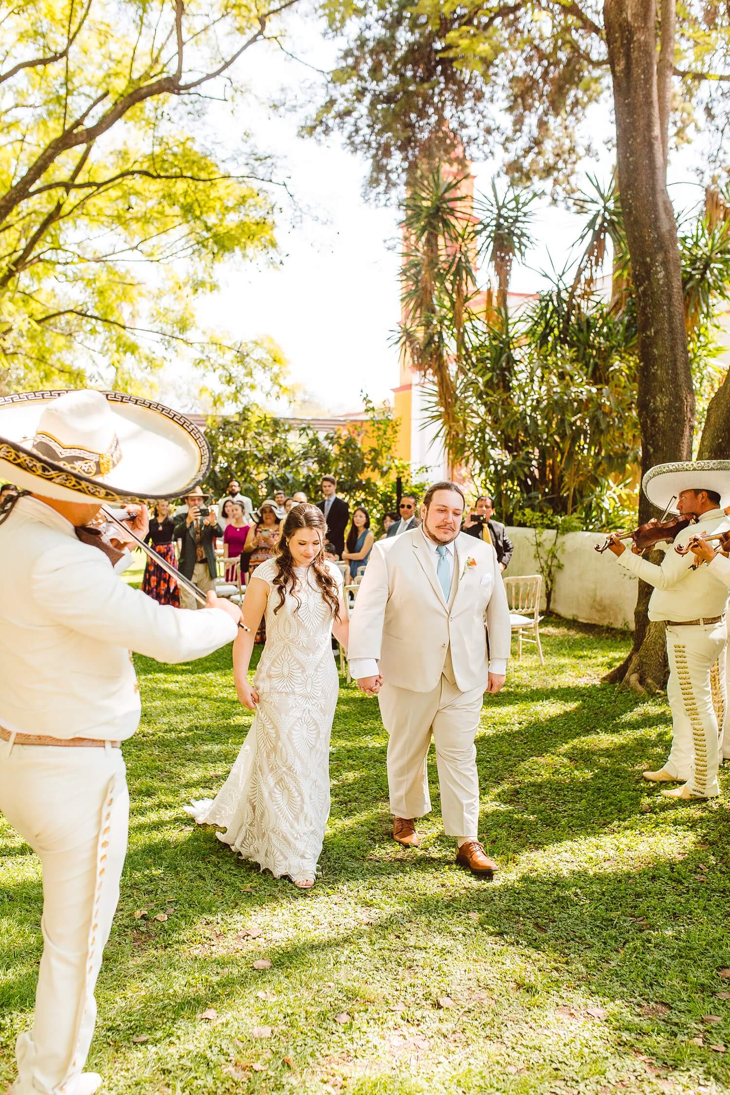 Bride and groom exiting ceremony to mariachi band | Brooke Michelle Photo