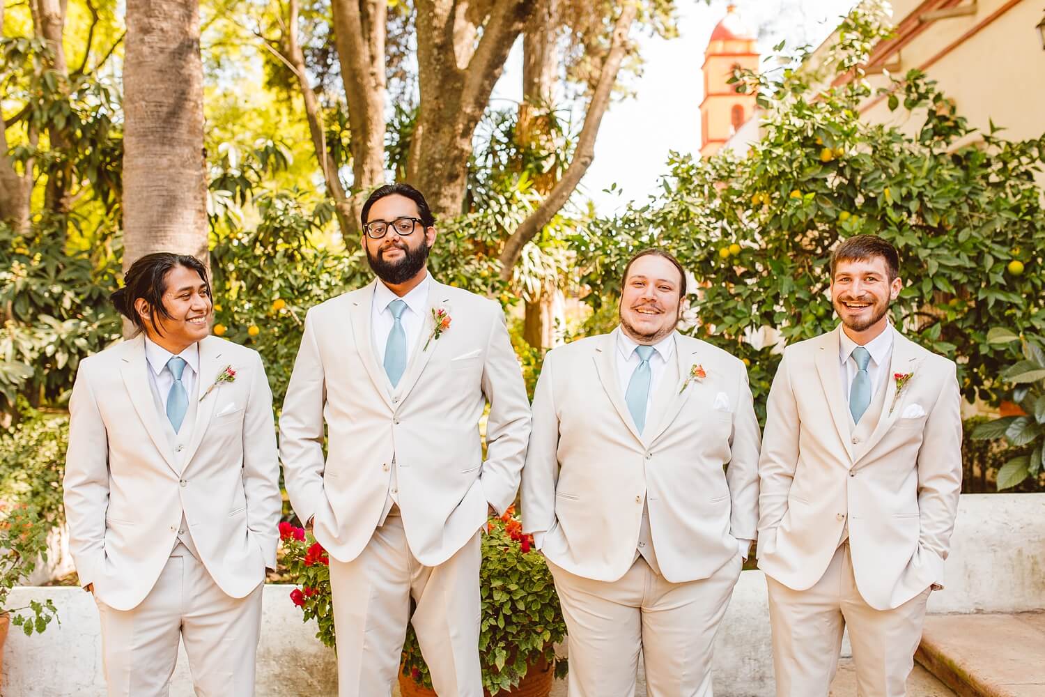 Groom with groomsmen in tan suits at Mexico destination wedding | Brooke Michelle Photo