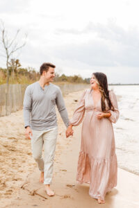 Couple walking along Terrapin beach in Maryland