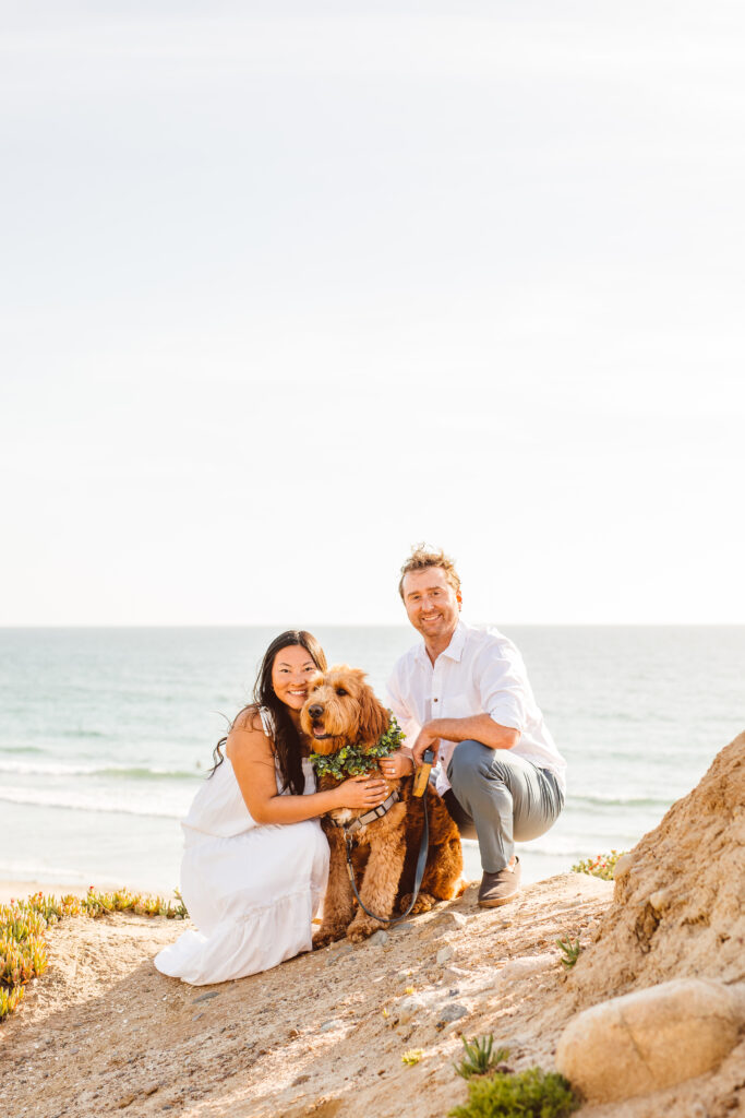 Couples beach engagement session with their dog