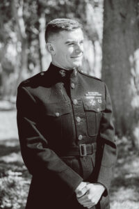Groom watching bride walk down the aisle