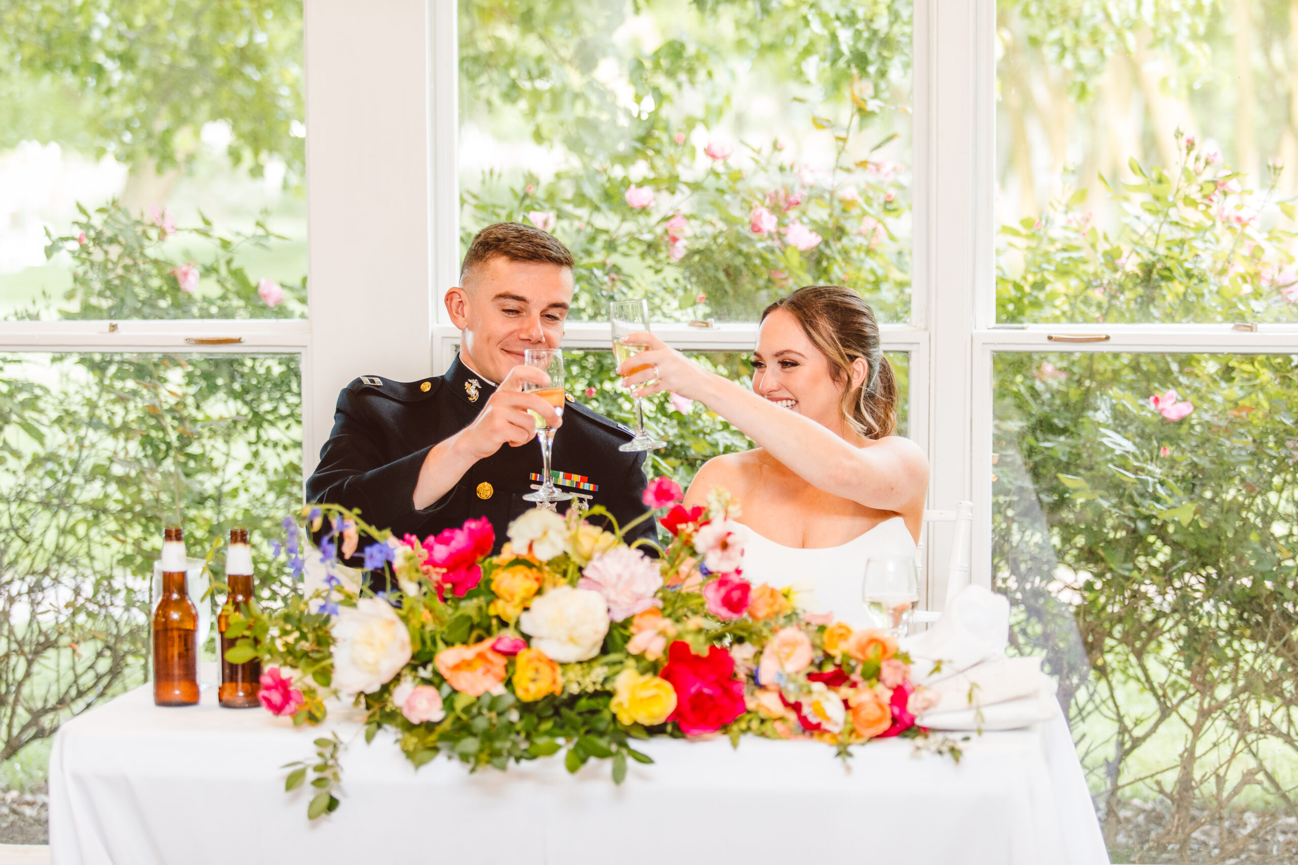 Bride and groom toasting during speeches