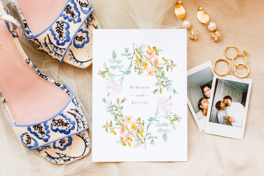 details, brides shoes, wedding invitation and polaroids of the bride and groom
