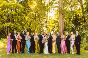 bride and groom with their bridesmaids and groomsmen at their garden wedding