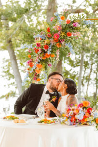 couple kissing at their reception at their garden wedding