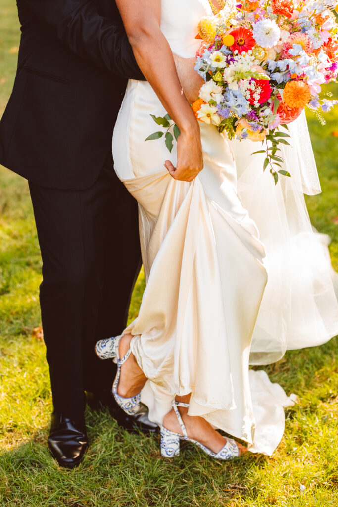 closeup of the bride and groom attire