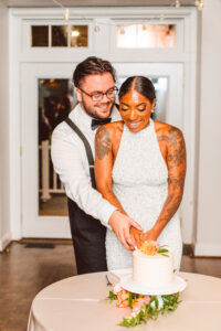 couple cutting their cake at their reception
