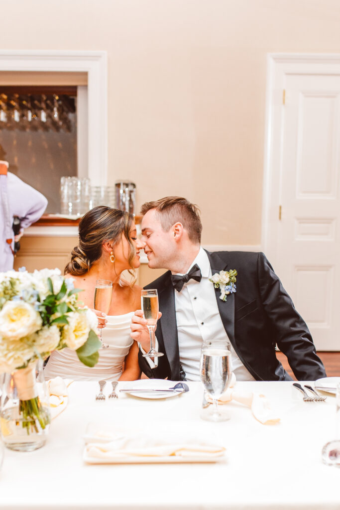 bride and groom kissing at their reception
