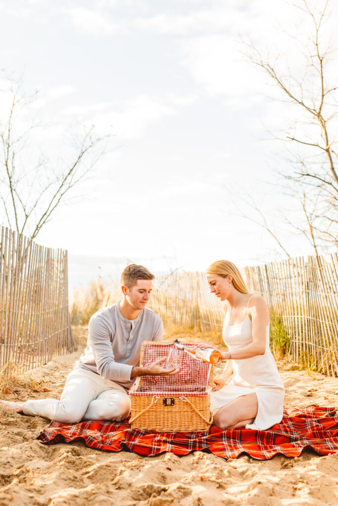 couple eating at their picnic engagement session