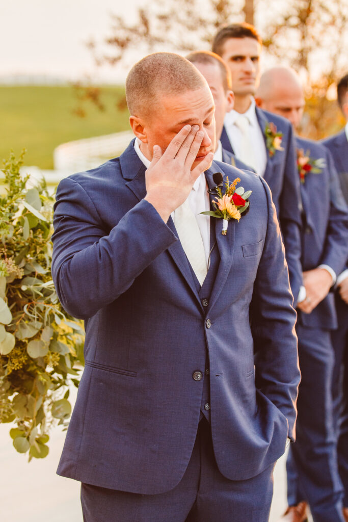 groom crying at his ethereal autumn wedding ceremony