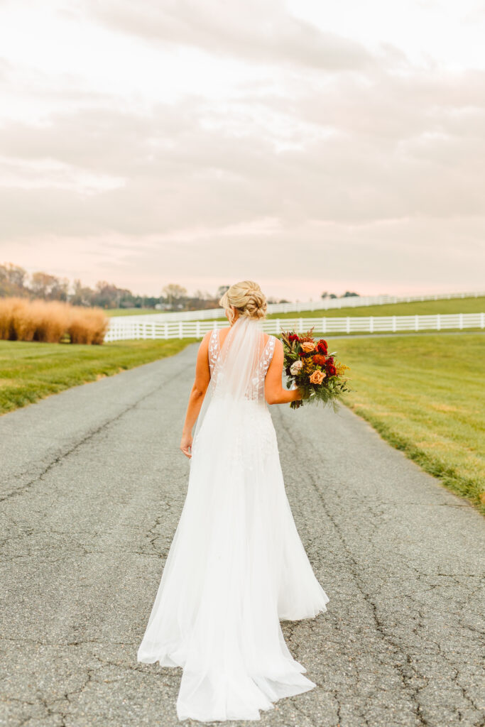 bride holding her ethereal autumn wedding bouquet