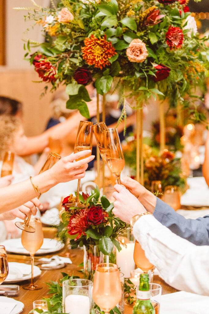 guests drinking champagne ethereal autumn wedding