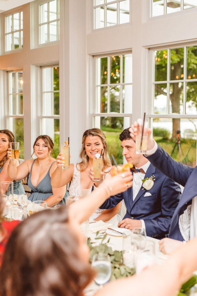 bride and groom toasting with their friends