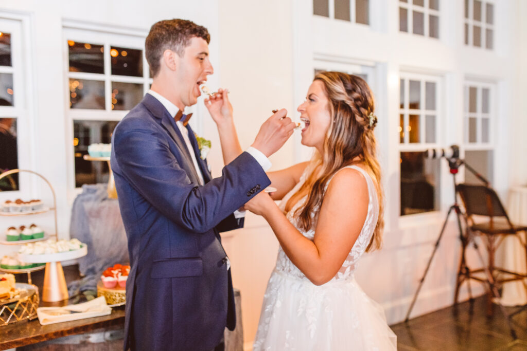 bride and groom eating their wedding cake