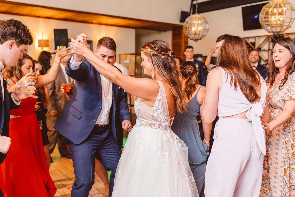 bride dancing with her wedding guests