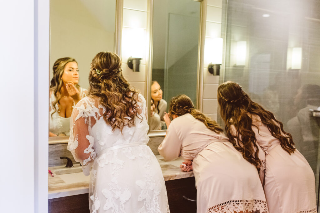 bride and bridesmaids getting ready for the elegant bayside wedding ceremony