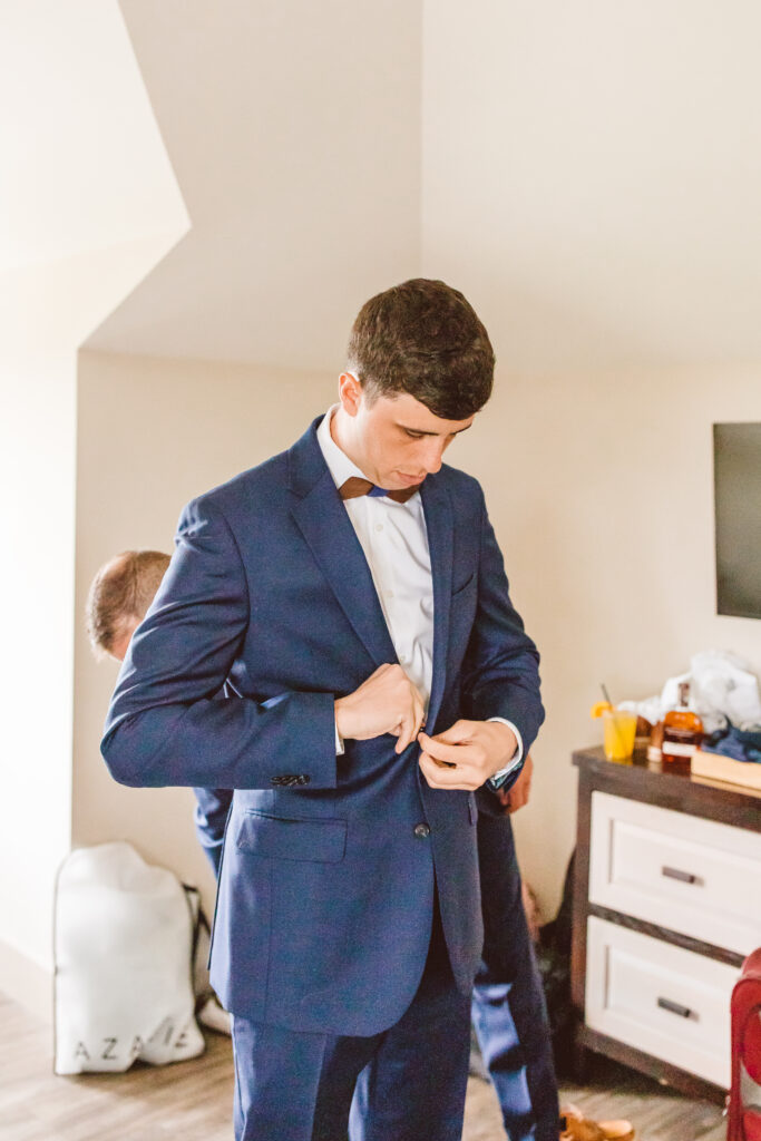 groom dressing for the wedding ceremony
