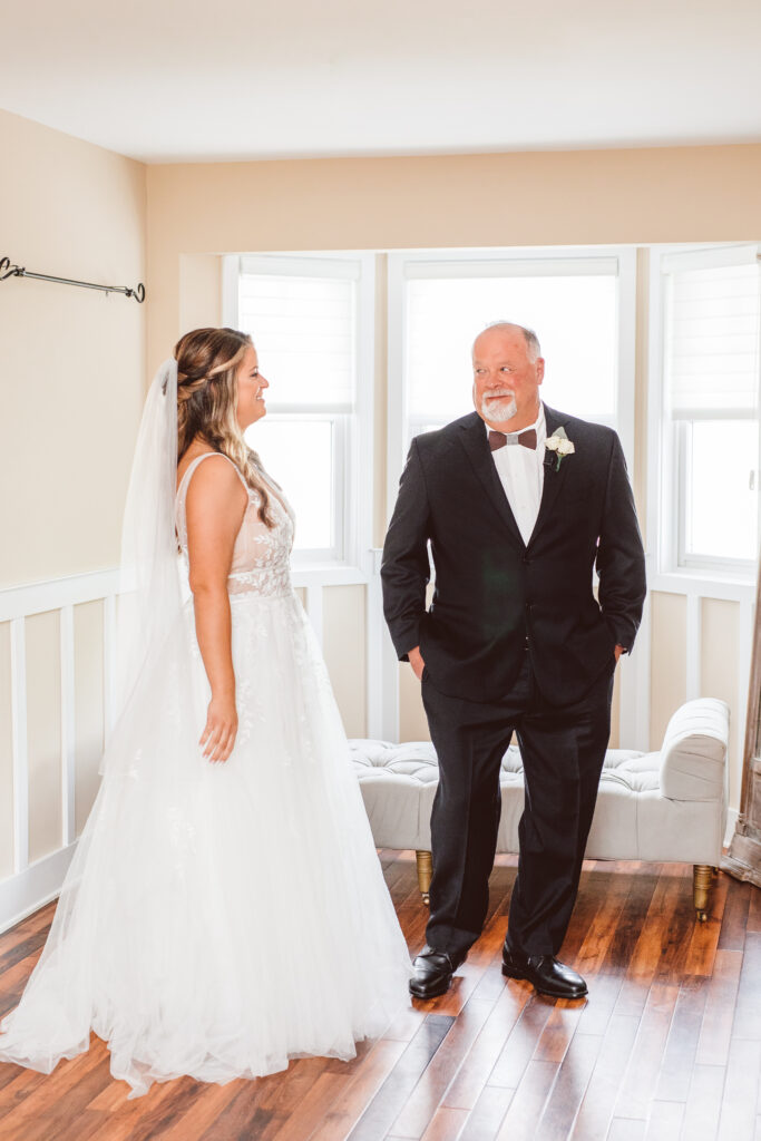 bride first look with her father