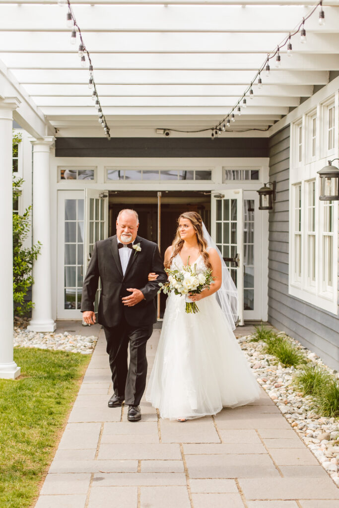 bride and her dad walking down the aisle